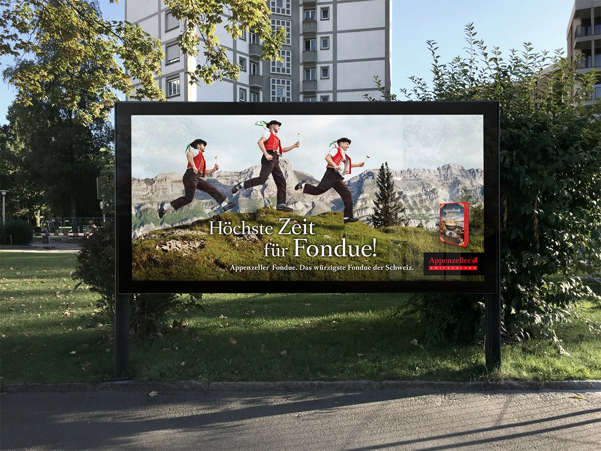 Affiche pour la fondue Appenzeller avec trois hommes sautant dans un paysage alpin.