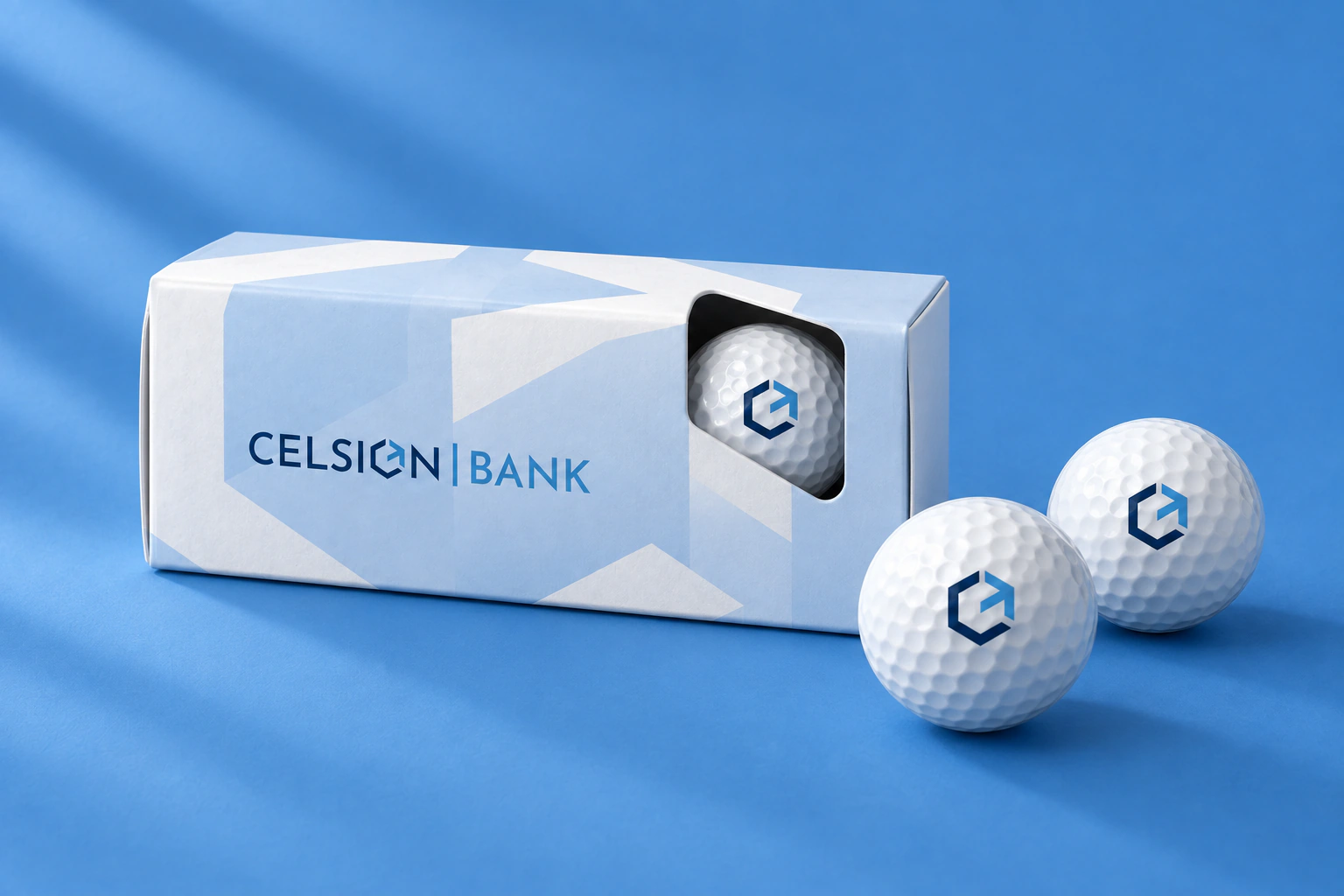Maquette d’un coffret de balles de golf portant le logo Celsion Bank.
