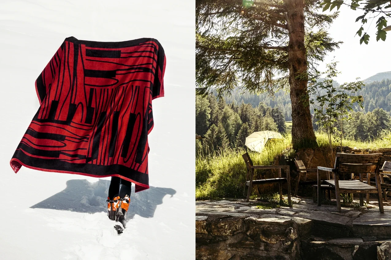 Plaid Guarda Val rouge et noir, associé à une terrasse en forêt.